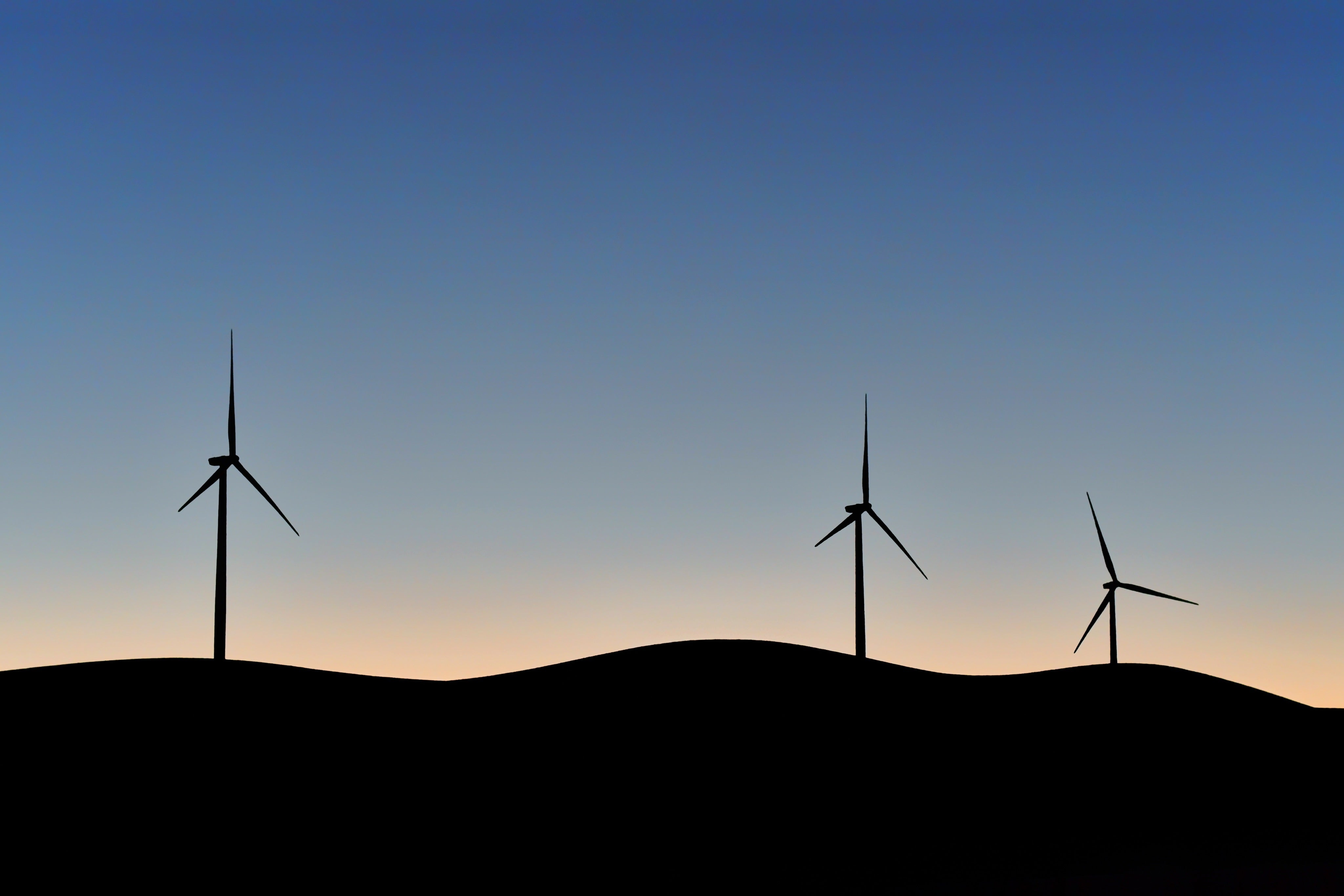 Silhouettes of wind turbines